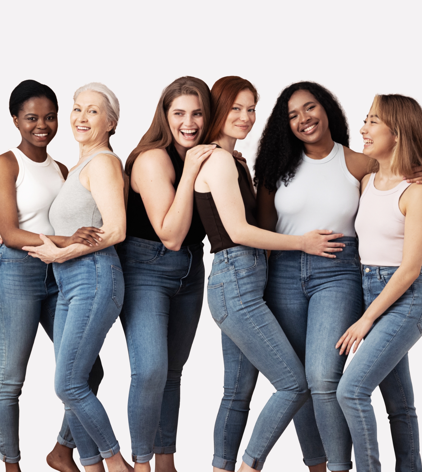 Diverse group of women of different ages and ethnicities smiling together, representing inclusive beauty care